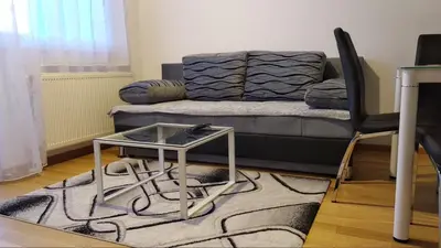 a living room with a couch and a table at Centar Banja Luka Apartman MIKI in Banja Luka