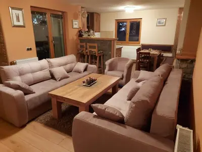 a living room with a couch and a table at Villa Franka - Vlašić in Vlasic