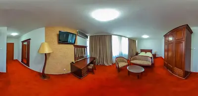 a hotel room with a bed and a living room at Hotel San Terme Laktaši in Laktaši