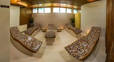 a room with a bunch of tables and chairs at Hotel San Terme Laktaši in Laktaši