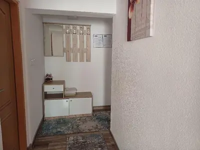 a hallway with a room with a sink and a mirror at Vela-edo in Zavidovići