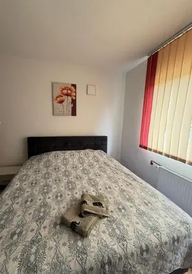 a bedroom with a bed with a skull and amitted at Vela-edo in Zavidovići