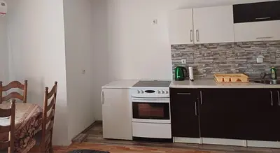 a small kitchen with a stove and a sink at Vela-edo in Zavidovići