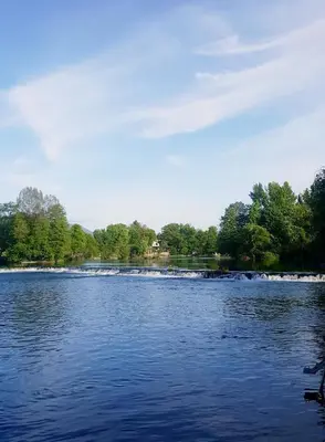 a large body of water with trees in the background at Hotel Opal Exclusive Bihać in Bihać