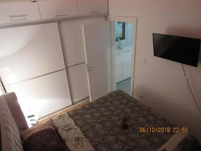 a living room with a couch and a flat screen tv at Apartman Tea 2 in Banja Luka