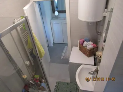 a small bathroom with a sink and a toilet at Apartman Tea 2 in Banja Luka