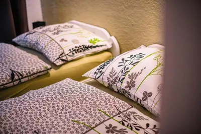 a group of pillows sitting on a shelf in a room at Apartman Luka in Livno