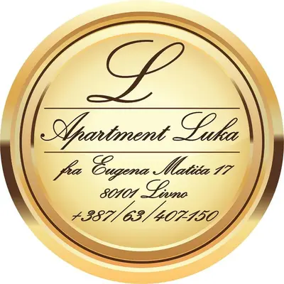 a gold round frame with the name of a restaurant latrine with a signature at Apartman Luka in Livno