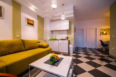 a living room with a couch and a table at Apartman Luka in Livno