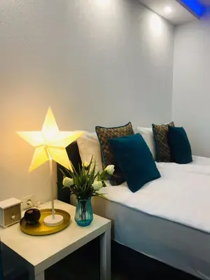 a bedroom with a bed with a star on a table at Moonlight Visoko in Visoko