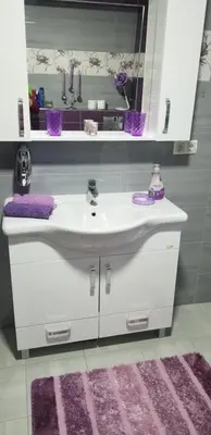 a bathroom with a white sink and a mirror at Apartmani Kadunić in Bugojno