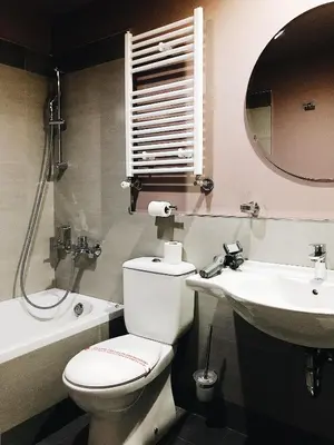 a bathroom with a toilet and a sink and a mirror at Banja Kulaši in Kulaši