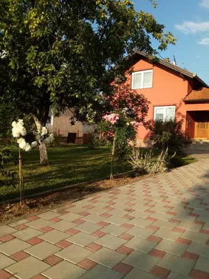 a brick driveway in front of a house at ENNI in Bihać