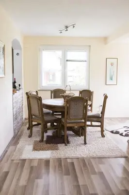 a dining room with a table and chairs at ENNI in Bihać