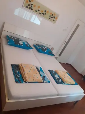 a set of three stairs with four ties on them at Apartman Nena in Banja Luka