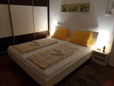 a bed with two pillows on it in a room at Apartman Nena in Banja Luka