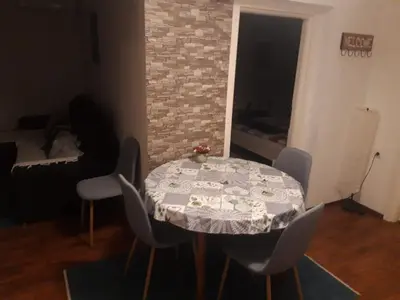a table with a table cloth on it in a room at Apartman Nena in Banja Luka