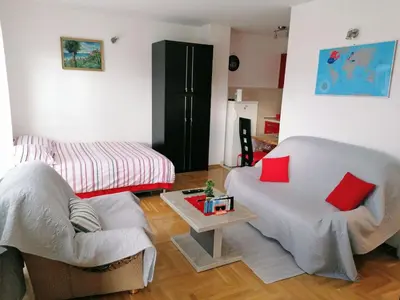 a living room with two chairs and a table at Good Host in Banja Luka