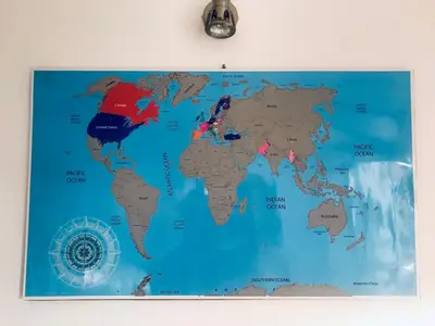 a map of the world hanging on a wall at Good Host in Banja Luka