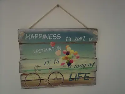 a sign that says happiness is not a destination it is a way of life at Good Host in Banja Luka