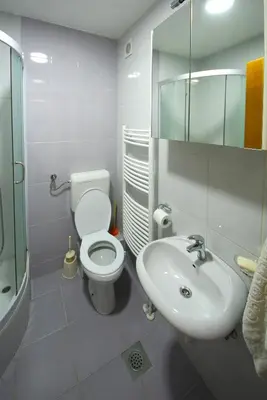 a bathroom with a toilet and a sink at Good Host in Banja Luka