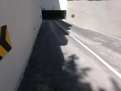 a shadow of a person walking down a tunnel at NM Apartman in Banja Luka