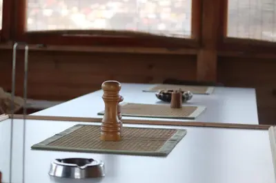 a wooden chess piece sitting on top of a table at Horizont apartmans in Jajce