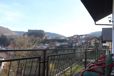 a view of a city from a balcony of a building at Horizont apartmans in Jajce