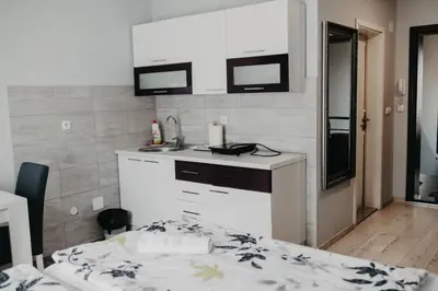 a kitchen with a sink and a counter top at Prenoćište Park in Modriča