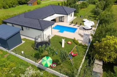 an aerial view of a house with a playground at Villa Diamond in Bihać