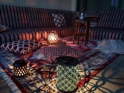 a living room with a couch and lights on a rug at Villa Diamond in Bihać