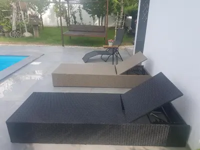 a couple of cardboard boxes sitting next to a pool at Holiday Home Edi in Bihać