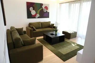 a living room with a couch and a coffee table at Zepter Hotel in Bosanska Dubica