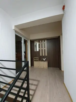 a room with a staircase and a building with a door at Apartman Marković in Bosanski Šamac
