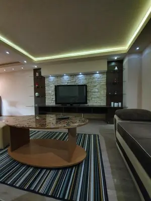 a living room with a couch and a coffee table at Apartman Marković in Bosanski Šamac
