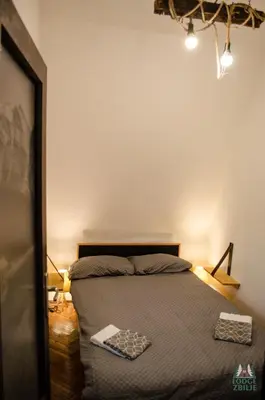 a bedroom with a bed and a mirror at Lodge Zbilje Visoko, Bosnian Pyramids in Visoko