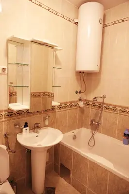 a bathroom with a sink and a toilet and a tub at Apartment Dajak Centar in Banja Luka