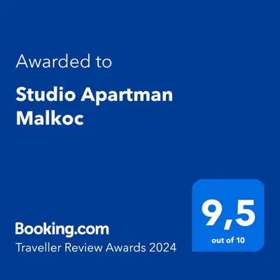 a blue sign with the text awarded to studio apartmentkin malico at Studio Apartman Malkoc in Bihać