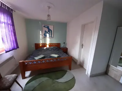 a small bedroom with a bed and a window at Atlantis Home in Kulen Vakuf