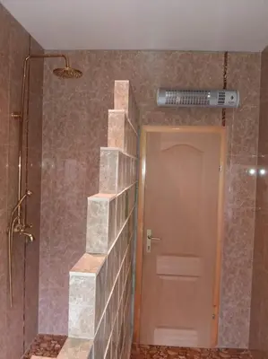 a bathroom with a staircase next to a shower at Sam guest house in Jajce