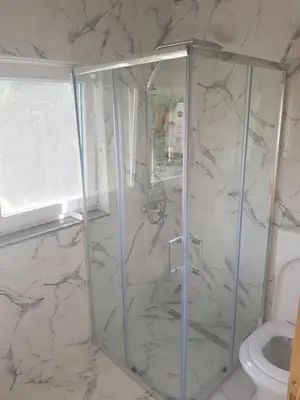 a bathroom with a shower and a toilet at Sam guest house in Jajce