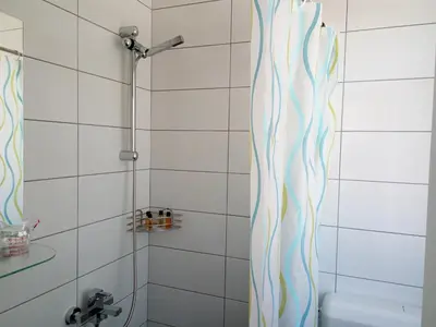 a shower curtain in a bathroom with a toilet at Apartments&Rooms Mido in Visoko