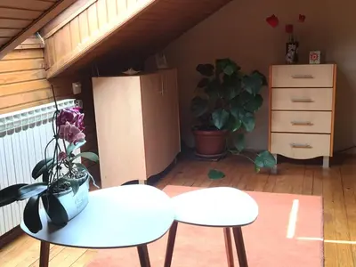 a room with a table and two chairs and a dresser at Villa Irena in Visoko