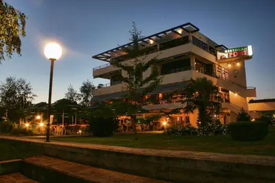 a building with a street light in front of it at Hotel Le Pont in Prijedor