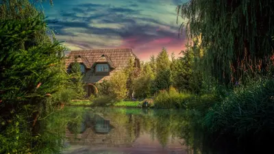 a painting of a house next to a river at Etno Village Cardaci in Vitez