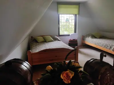 a bedroom with two beds and a window at Green Paradise in Visoko