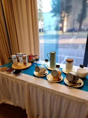 a table with plates of food on top of it at Hotel Safir in Bihać