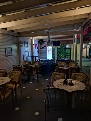 an empty dining room with tables and chairs at Apartman Nik-Rom in Bosanska Gradiška