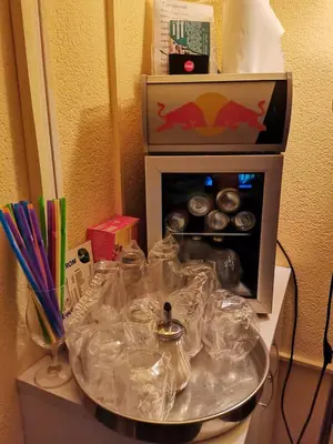 a table with a counter top with a box of food at Apartman Nik-Rom in Bosanska Gradiška