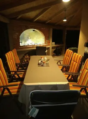 a dining room with a table and chairs and a table and chairsktop at Apartman Ena in Bihać
